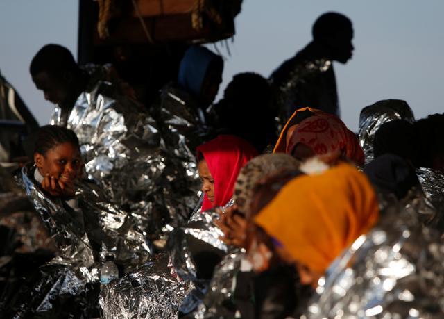 Migrants rest on the Malta-based NGO Migrant Offshore Aid Station (MOAS) ship Phoenix after being rescued from a rubber dinghy in the central Mediterranean in international waters off the coast of Sabratha in Libya, April 15. (REUTERS)