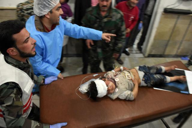A Syrian child, wounded in a suicide car bombing that targeted their buses in Rashidin, west of Aleppo on April 15. (AFP Photo) A Syrian child, wounded in a suicide car bombing that targeted their buses in Rashidin, west of Aleppo on April 15. (AFP Photo)