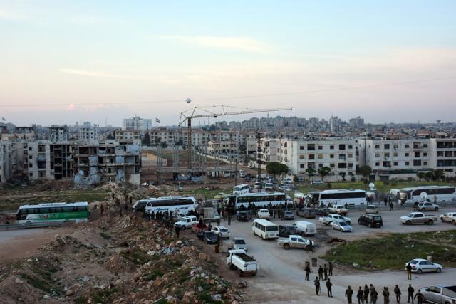 Buses gather at Aleppo's Ramousseh crossing, before driving to Rashidin, west of Aleppo, to pick up the civilians stranded following a suicide car bombing on April 15. (AFP Photo) Buses gather at Aleppo's Ramousseh crossing, before driving to Rashidin, west of Aleppo, to pick up the civilians stranded following a suicide car bombing on April 15. (AFP Photo)