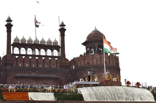 Prime Minister Narendra Modi speaks at an Independence Day celebrations at Red Fort in New Delhi, India. ABOUT THE MONUMENT: This site, which becomes a riot of colours on the Independence Day, was built as the palace fort of Shahjahanabad, the capital of the fifth Mughal Emperor, Shah Jahan. The walls of red sandstone, adjacent to the Salimgarh fort, built by Islam Shah Suri in 1546, forms the Red Fort Complex. While the planning of the palace is based on Islamic prototypes, each architectural element reflects a fusion of Persian, Timurid and Hindu traditions. Source: Delhi Tourism, UNESCO. (Vipin Kumar/HT Photo) Prime Minister Narendra Modi speaks at an Independence Day celebrations at Red Fort in New Delhi, India. ABOUT THE MONUMENT: This site, which becomes a riot of colours on the Independence Day, was built as the palace fort of Shahjahanabad, the capital of the fifth Mughal Emperor, Shah Jahan. The walls of red sandstone, adjacent to the Salimgarh fort, built by Islam Shah Suri in 1546, forms the Red Fort Complex. While the planning of the palace is based on Islamic prototypes, each architectural element reflects a fusion of Persian, Timurid and Hindu traditions. Source: Delhi Tourism, UNESCO. (Vipin Kumar/HT Photo)