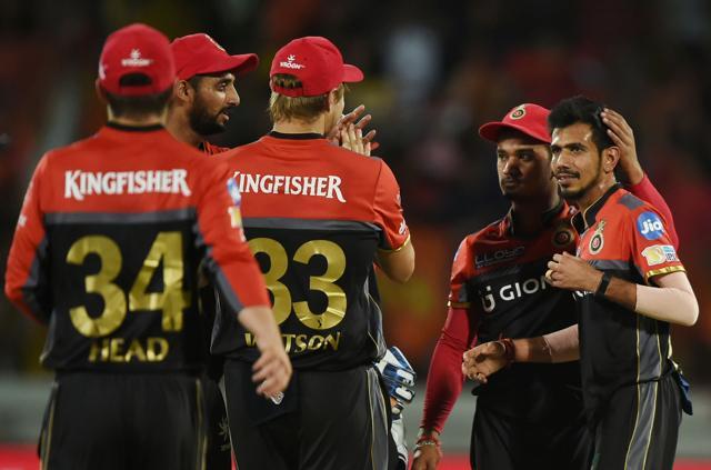 Royal Challengers Bangalore spinner Yuzvendra Chahal (R) is congratulated by teammates after his dismissal of Gujarat Lions captain Suresh Raina at the Saurashtra Cricket Association Stadium in Rajkot on Tuesday. (AFP) Royal Challengers Bangalore spinner Yuzvendra Chahal (R) is congratulated by teammates after his dismissal of Gujarat Lions captain Suresh Raina at the Saurashtra Cricket Association Stadium in Rajkot on Tuesday. (AFP)
