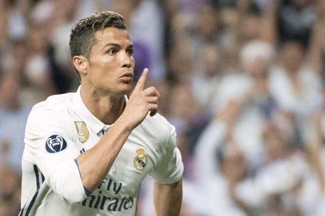 Real Madrid's Portuguese forward Cristiano Ronaldo celebrates scoring during the UEFA Champions League quarter-final second leg football match Real Madrid vs FC Bayern Munich at the Santiago Bernabeu stadium in Madrid on Tuesday. (AFP)