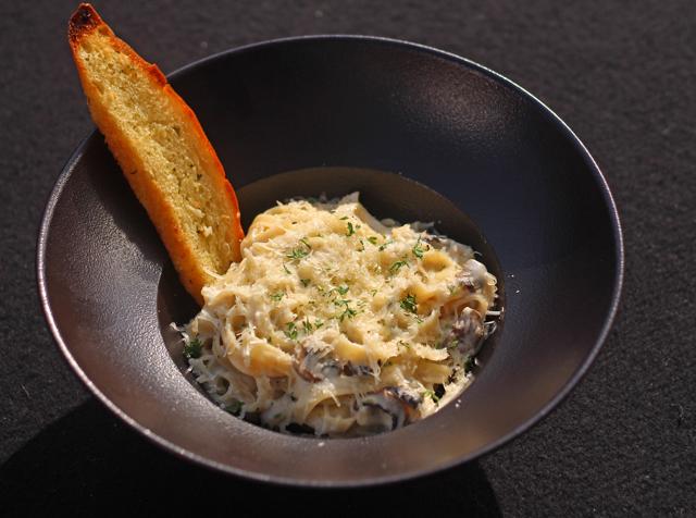 At The Stables, the tagliatelle ai funghi comes oozing with good pecorino cheese, a hit of truffle oil and sautéed mushrooms. (Satyabrata Tripathy / HT Photo)