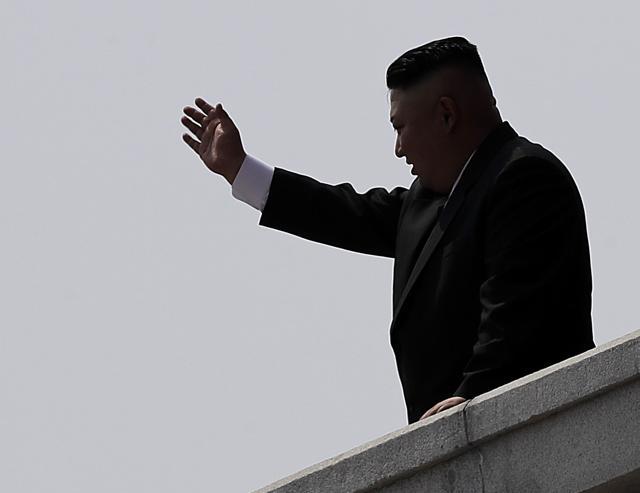 In this April 15 photo, North Korean leader Kim Jong Un is seen in silhouette as he waves during a military parade in Pyongyang. (AP) In this April 15 photo, North Korean leader Kim Jong Un is seen in silhouette as he waves during a military parade in Pyongyang. (AP)