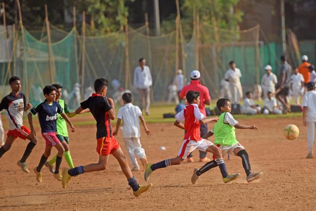 Youngsters play football at Shivaji Park, Dadar in Mumbai. (Pratik Chorge/HT Photo)