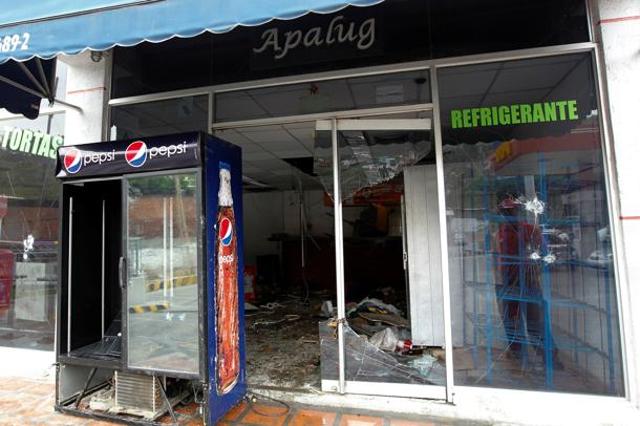 Damage is seen at a convenience store, after it was looted in Caracas, Venezuela on April 21. (REUTERS) Damage is seen at a convenience store, after it was looted in Caracas, Venezuela on April 21. (REUTERS)