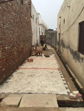 Interlocking tiles being installed on a street at Doburji village in Ludhiana on Saturday. (HT Photo) Interlocking tiles being installed on a street at Doburji village in Ludhiana on Saturday. (HT Photo)