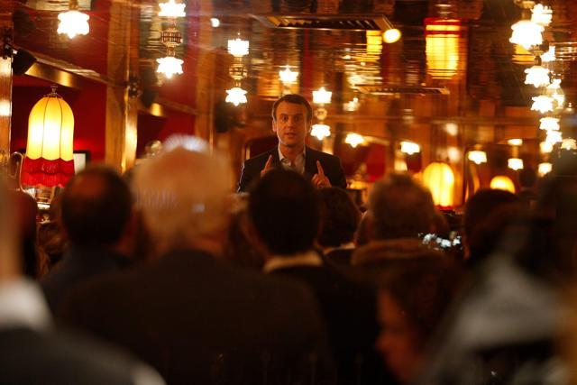 Emmanuel Macron meets some of his supporters at La Rotonde restaurant in Paris. (AFP Photo)