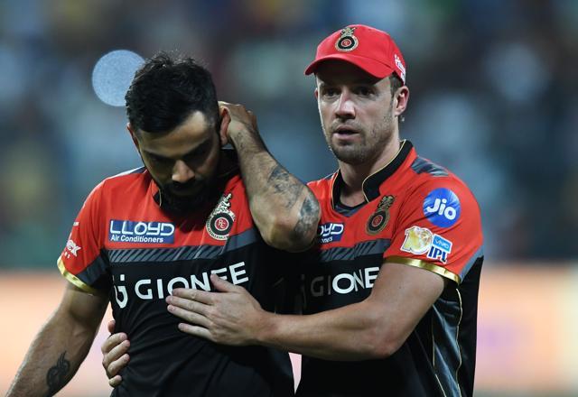 Royal Challengers Bangalore captain Virat Kohli reacts as teammate AB de Villiers(R) consoles him after the heavy defeat at Eden Gardens on Sunday. (AFP) Royal Challengers Bangalore captain Virat Kohli reacts as teammate AB de Villiers(R) consoles him after the heavy defeat at Eden Gardens on Sunday. (AFP)