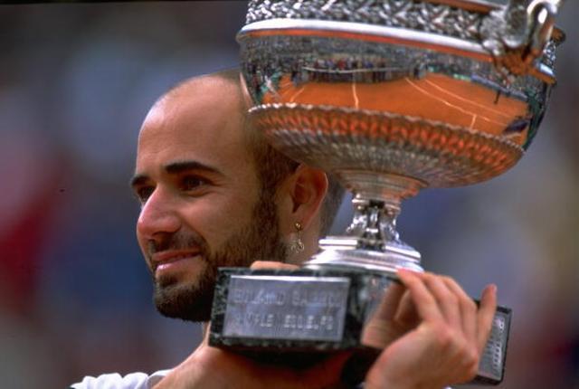 June 6, 1999: Andre Agassi of the United States celebrates with the trophy after beating Andrei Medvedev of the Ukraine in the final of the 1999 French Open at Roland Garros in Paris. (Getty Images) June 6, 1999: Andre Agassi of the United States celebrates with the trophy after beating Andrei Medvedev of the Ukraine in the final of the 1999 French Open at Roland Garros in Paris. (Getty Images)