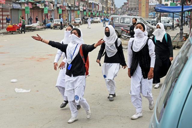 Girl students shout slogans during clashes with security personnel in Lal Chowk in Srinagar on April 24. (PTI Photo) Girl students shout slogans during clashes with security personnel in Lal Chowk in Srinagar on April 24. (PTI Photo)