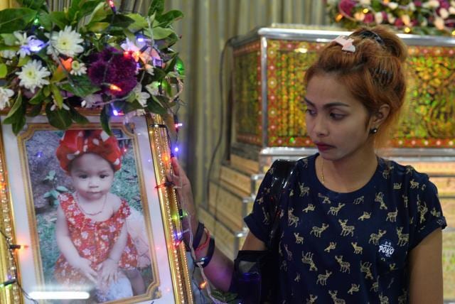 Jiranuch Trirat stands next to a picture of her daughter at a temple in Phuket, Thailand. (Reuters Photo) Jiranuch Trirat stands next to a picture of her daughter at a temple in Phuket, Thailand. (Reuters Photo)