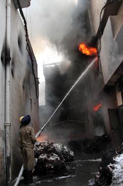 Firefighters on the job at the factory that saw a massive blaze in Ludhiana on Saturday, April 29. (JS Grewal/HT) Firefighters on the job at the factory that saw a massive blaze in Ludhiana on Saturday, April 29. (JS Grewal/HT)