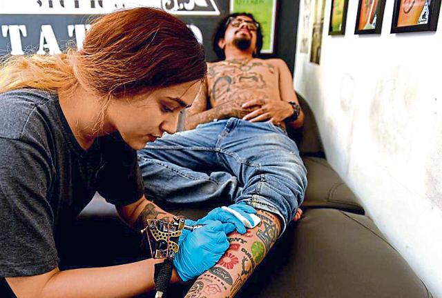 Jason George has about 400 tattoos and so loves them that he became a tattoo artist. But even he has limits. ‘Most people want a tattoo where they can easily flaunt it. But a chunky tattoo on your neck, for instance, may not be acceptable in many corporate environments. Almost all of my tattoos get covered when I wear a T-shirt and jeans,’ he says. (Bachchan Kumar / HT Photo)