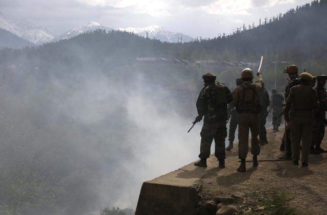 Securitymen clashed with Kashmiri villagers who were demanding the bodies of militants killed in a gun battle after a group of militants stormed a military camp in Panzgam, Kupwara. (AP Photo)