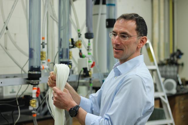 University of British Columbia professor Pierre Berube explains the new system of water filtration aimed at small and remote communities in Canada and India. (Image courtesy: University of British Columbia)