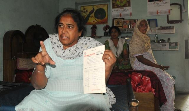 Surinder Kaur, mother of another man arrested on peddling charges, showing his medical records at Mullanpur Dakha village, in Ludhiana. (Anil Dayal/HT Photo) Surinder Kaur, mother of another man arrested on peddling charges, showing his medical records at Mullanpur Dakha village, in Ludhiana. (Anil Dayal/HT Photo)