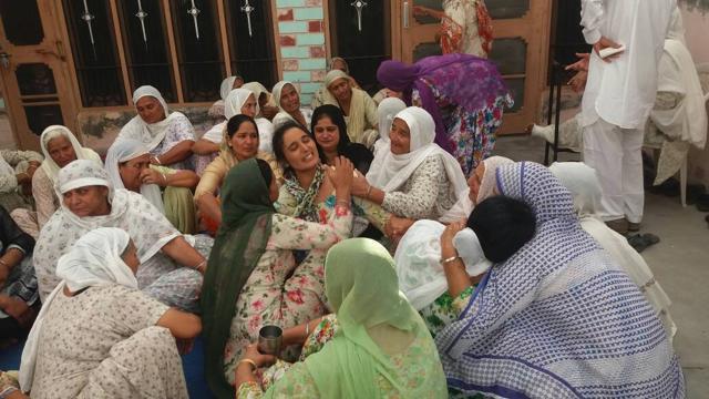 Women console Paramjeet Singh’s wife. (Sanjeev Sharma/HT Photo) Women console Paramjeet Singh’s wife. (Sanjeev Sharma/HT Photo)