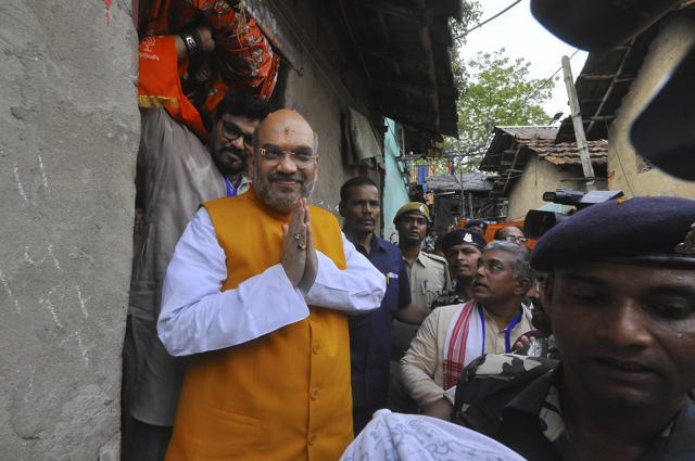 Amit Shah visit a slum in chief minister Mamata Banerjee’s constituency Bhawanipore. The focus of his visit was to step up the connect with common people and kick off the ‘booth chalo’ drive. (Samir Jana/HT PHOTO) Amit Shah visit a slum in chief minister Mamata Banerjee’s constituency Bhawanipore. The focus of his visit was to step up the connect with common people and kick off the ‘booth chalo’ drive. (Samir Jana/HT PHOTO)