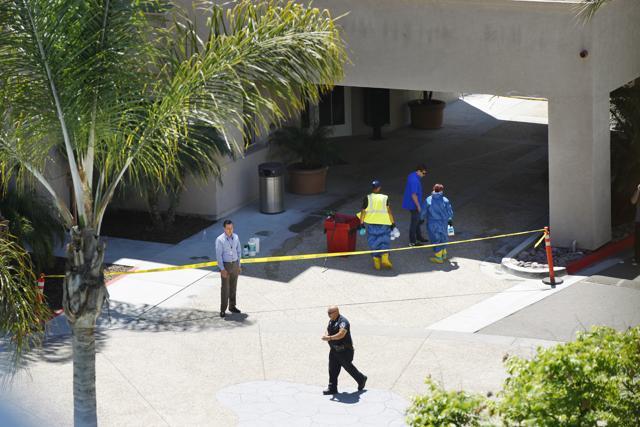 Crews clean up blood on the ground at the La Jolla Crossroads apartments (AP Photo) Crews clean up blood on the ground at the La Jolla Crossroads apartments (AP Photo)
