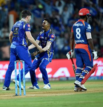 Mumbai Indians’s bowler Mitchell John McClenaghan (L) celebrates the dismissal of Sanju Samson during the IPL match against Delhi Daredevils in Mumbai. (PTI) Mumbai Indians’s bowler Mitchell John McClenaghan (L) celebrates the dismissal of Sanju Samson during the IPL match against Delhi Daredevils in Mumbai. (PTI)