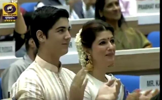 Wife Twinkle Khanna and son Aarav watch proudly as Akshay receives his National Award.
