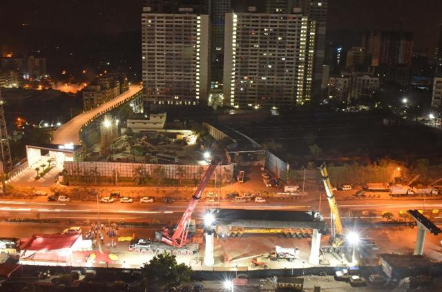 A 150-tonne U girder—a concrete structure on which metro tracks are laid—was launched between Pier 62 and Pier 63 on the 16.5km long corridor. “It is a historic moment for us. With the girder launch, it shows that the pace of construction is fast,” Fadnavis told reporters. (Pratham Gokhale/HT) A 150-tonne U girder—a concrete structure on which metro tracks are laid—was launched between Pier 62 and Pier 63 on the 16.5km long corridor. “It is a historic moment for us. With the girder launch, it shows that the pace of construction is fast,” Fadnavis told reporters. (Pratham Gokhale/HT)