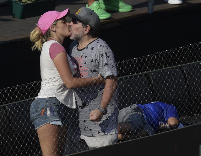 Argentine football legend Diego Maradona and his girlfriend Rocio Oliva kiss during the 2017 Davis Cup World Group first round singles match between Italy and Argentina at Parque Sarmiento stadium in Buenos Aires on February 3, 2017. (AFP) Argentine football legend Diego Maradona and his girlfriend Rocio Oliva kiss during the 2017 Davis Cup World Group first round singles match between Italy and Argentina at Parque Sarmiento stadium in Buenos Aires on February 3, 2017. (AFP)