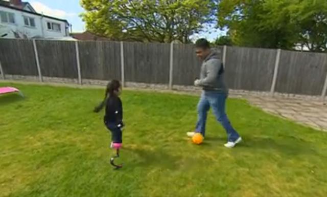 Anu plays football with her father. (Screengrab)