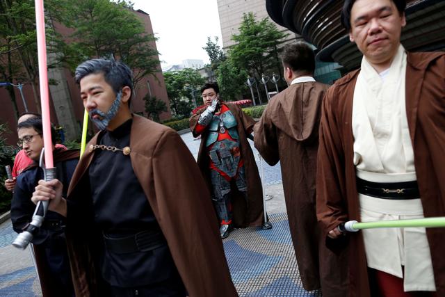 Fans dressed as the characters from Star Wars react during Star Wars Day in Taipei. (REUTERS) Fans dressed as the characters from Star Wars react during Star Wars Day in Taipei. (REUTERS)