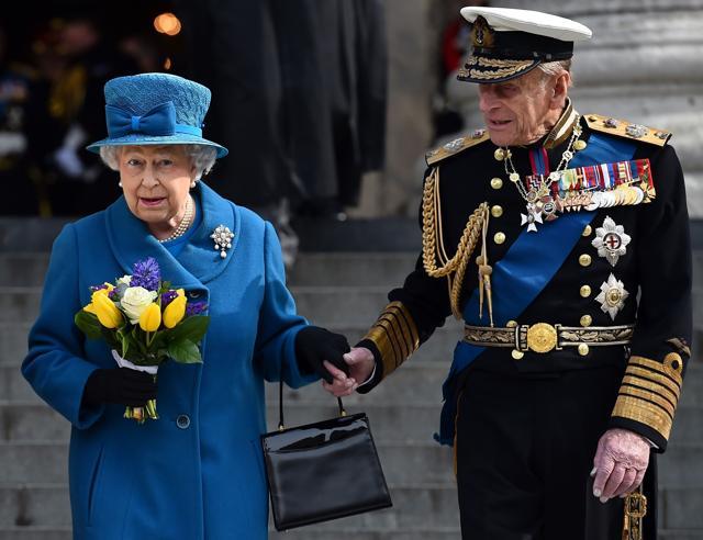 File photo from March 2015 shows Britain's Queen Elizabeth II and Britain's Prince Philip, Duke of Edinburgh, leaving St Paul's Cathedral in London after attending a memorial service to mark the end of Britain's combat operations in Afghanistan. (AFP)