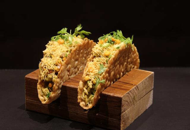 The Drunken Bhel starter is a pleaser, served in thin taco-like sev puri shells, with lightly rum-spiked chutneys. We visited thrice and at every meal we considered seconds. (Bhushan Koyande / HT Photo)