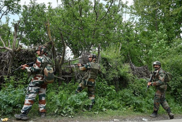 Army personnel stand guard during a search at a village in Shopian district in Kashmir. (PTI) Army personnel stand guard during a search at a village in Shopian district in Kashmir. (PTI)