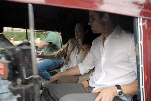 Brad Pitt (R) and Angelina Jolie (C) sit with their son Maddox (2R) inside an auto rickshaw as they take a tour of Pune. (AFP) Brad Pitt (R) and Angelina Jolie (C) sit with their son Maddox (2R) inside an auto rickshaw as they take a tour of Pune. (AFP)
