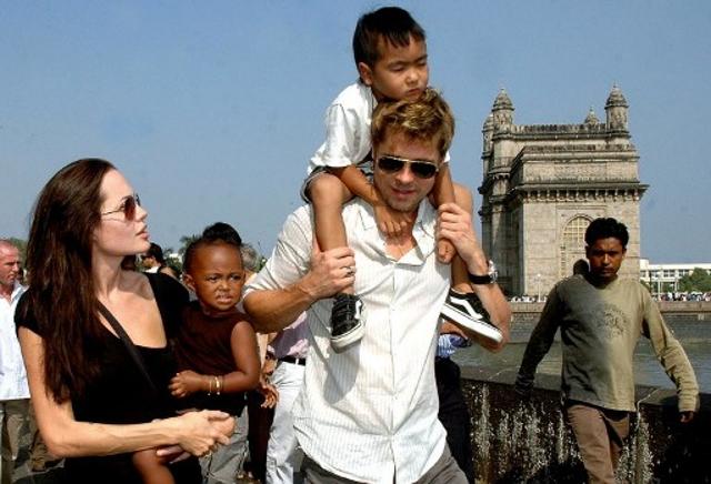US actor Angelina Jolie (L) holds daughter Zahara as husband and actor Brad Pitt (C) carries son Maddox during a stroll on the seafront promenade at the historic Gateway of India. (AFP) US actor Angelina Jolie (L) holds daughter Zahara as husband and actor Brad Pitt (C) carries son Maddox during a stroll on the seafront promenade at the historic Gateway of India. (AFP)