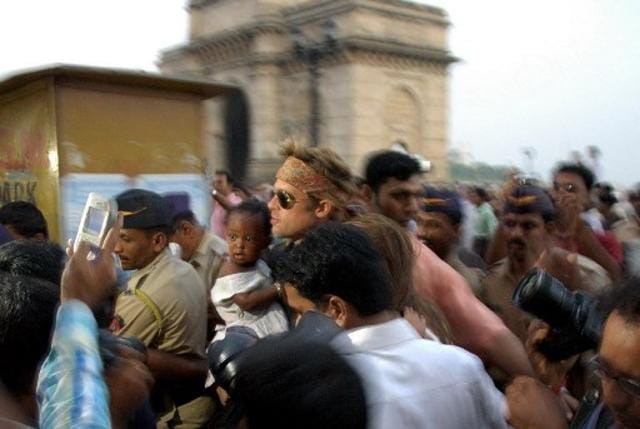 Brad Pitt (C) with daughter Zahara is followed by fans and photographers as they walk away from the getty towards their car after a visit to the Elephanta Island from Gateway of India in Mumbai, 18 November 2006. (AFP) Brad Pitt (C) with daughter Zahara is followed by fans and photographers as they walk away from the getty towards their car after a visit to the Elephanta Island from Gateway of India in Mumbai, 18 November 2006. (AFP)