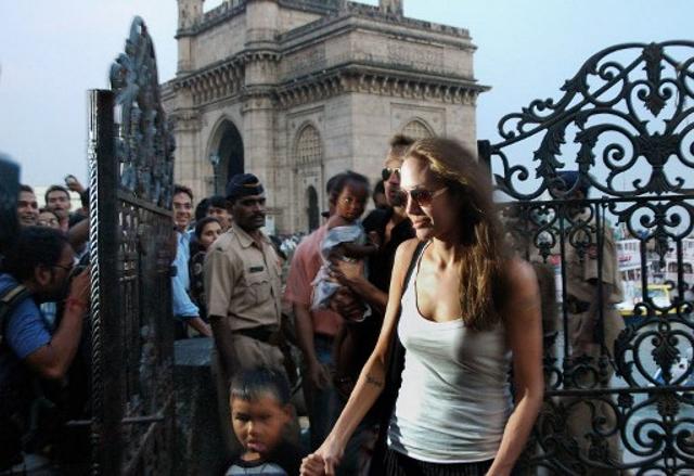 US actress and UNHCR Ambassador Angelina Jolie (R) with son Maddox and Brad Pitt (2R) with daughter Zahara leave the getty after a visit to the Elephanta Island from Gateway of India in Mumbai. The couple spent a month in India while Jolie was filming A Mighty Heart. (AFP) US actress and UNHCR Ambassador Angelina Jolie (R) with son Maddox and Brad Pitt (2R) with daughter Zahara leave the getty after a visit to the Elephanta Island from Gateway of India in Mumbai. The couple spent a month in India while Jolie was filming A Mighty Heart. (AFP)