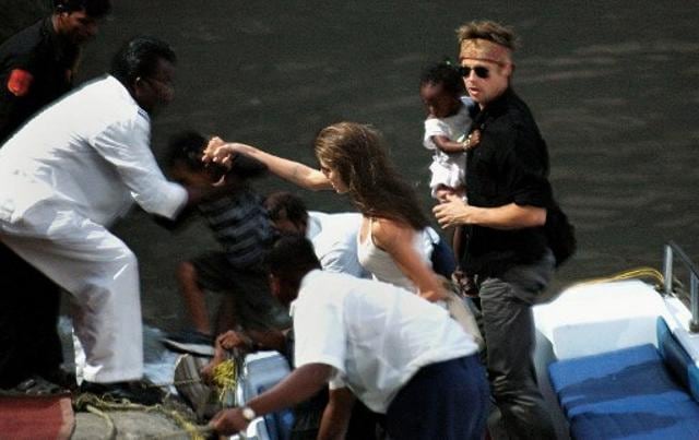 US actor and UNHCR Ambassador Angelina Jolie (3L) with son Maddox and Brad Pitt (L) with daughter Zahara climb onto the getty after a visit to the Elephanta Island from Gateway of India in Mumbai. (AFP) US actor and UNHCR Ambassador Angelina Jolie (3L) with son Maddox and Brad Pitt (L) with daughter Zahara climb onto the getty after a visit to the Elephanta Island from Gateway of India in Mumbai. (AFP)
