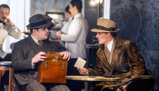 Johnny Depp consults with Josh Gad (L) who plays Hector MacQueen.