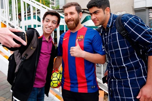 Reza Parastesh poses for a picture with fans in a street in Tehran. (AFP/Getty Images) Reza Parastesh poses for a picture with fans in a street in Tehran. (AFP/Getty Images)