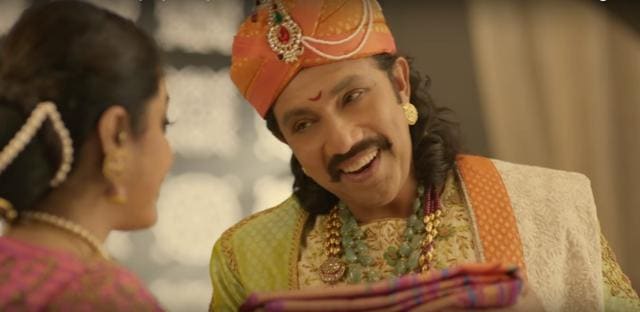 Sathyaraj placates Ramya with a new sari. Sathyaraj placates Ramya with a new sari.