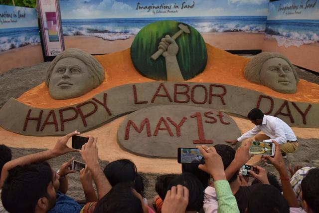 Dedicating to the labourers, sand artist Sudarsan Pattnaik made a sand sculpture at the lawns of India Gate on May 1. Dedicating to the labourers, sand artist Sudarsan Pattnaik made a sand sculpture at the lawns of India Gate on May 1.