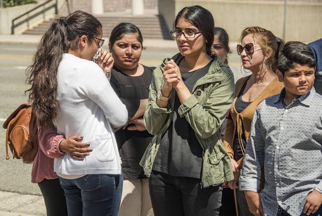 Gurmukh Singh's family comforts each other during a news conference before he is taken into custody. (AP Photo) Gurmukh Singh's family comforts each other during a news conference before he is taken into custody. (AP Photo)