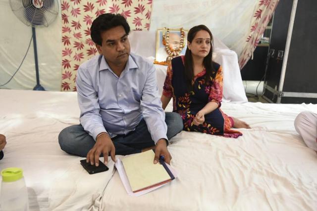 Former Delhi minister Kapil Mishra, with his wife Preeti, as he began ‘stayagraha’ at his house in Civil Lines. (Sonu Mehta /HT Photo) Former Delhi minister Kapil Mishra, with his wife Preeti, as he began ‘stayagraha’ at his house in Civil Lines. (Sonu Mehta /HT Photo)