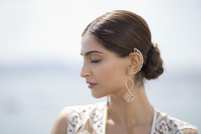 This 2015 look of Sonam Kapoor played with neutrals, with a braided bun completing the look. (AP) This 2015 look of Sonam Kapoor played with neutrals, with a braided bun completing the look. (AP)