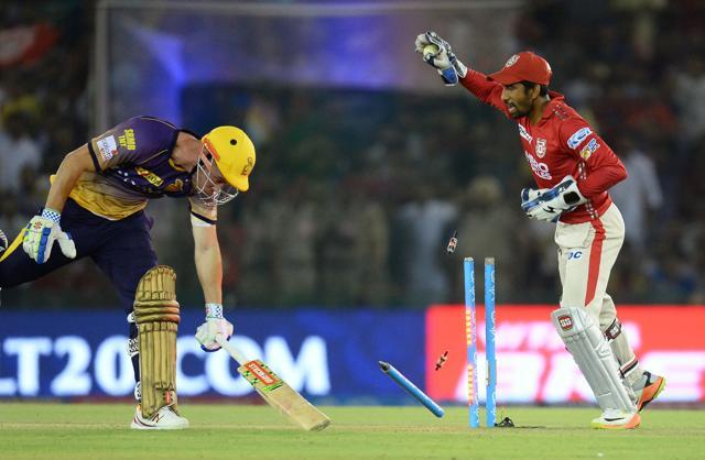 Kings XI Punjab wicketkeeper Wriddhaman Saha (R) sucessfully runs out Kolkata Knight Riders batsman Chris Lynn. (AFP) Kings XI Punjab wicketkeeper Wriddhaman Saha (R) sucessfully runs out Kolkata Knight Riders batsman Chris Lynn. (AFP)