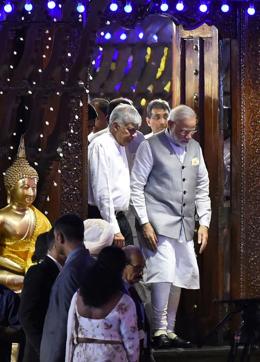 PM Narendra Modi with his Sri Lankan counterpart Ranil Wickremesinghe as they step out of a temple in Colombo on May 11, 2017. (AFP) PM Narendra Modi with his Sri Lankan counterpart Ranil Wickremesinghe as they step out of a temple in Colombo on May 11, 2017. (AFP)