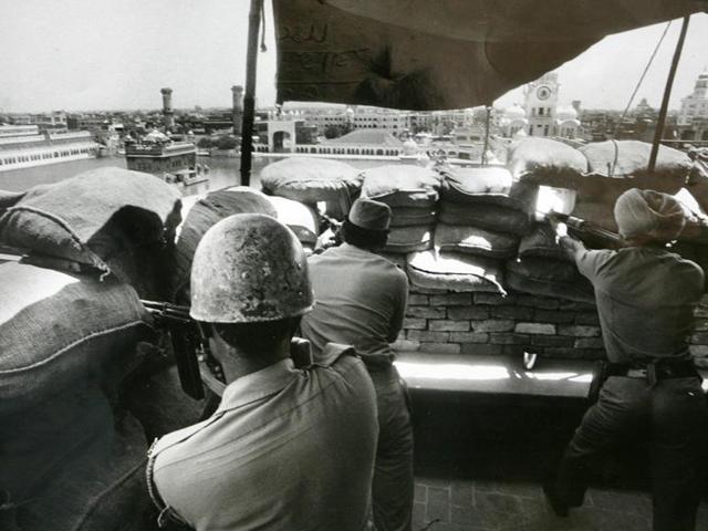 Army men take positions from a building adjoining the Golden Temple during the operation ordered by Indira Gandhi, the then prime minister, to remove Sikh separatists who were amassing weapons in the Temple in 1984. (India Today Group/Getty Images) Army men take positions from a building adjoining the Golden Temple during the operation ordered by Indira Gandhi, the then prime minister, to remove Sikh separatists who were amassing weapons in the Temple in 1984. (India Today Group/Getty Images)