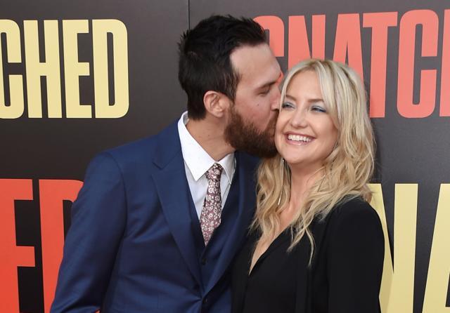 The two kissed each other in front of photographers. (AP) The two kissed each other in front of photographers. (AP)