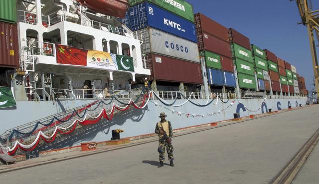 In this November 13, 2016 file photo, a Pakistan Navy soldier stands guard while a loaded Chinese ship prepares to depart from Gwadar port that links to China's far western region on a new international route exporting goods to West Asia and Africa, about 700km (435 miles) west of Karachi. Pakistan. (AP) In this November 13, 2016 file photo, a Pakistan Navy soldier stands guard while a loaded Chinese ship prepares to depart from Gwadar port that links to China's far western region on a new international route exporting goods to West Asia and Africa, about 700km (435 miles) west of Karachi. Pakistan. (AP)